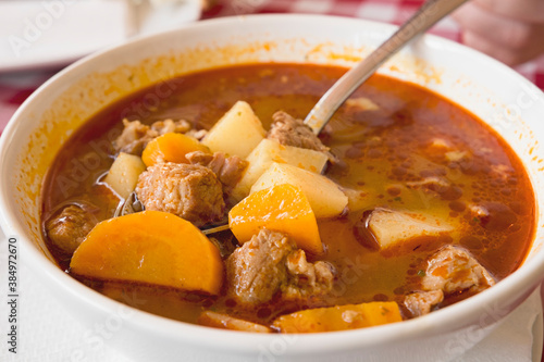 Hot meat goulash soup with paprika, potatoes and pieces of dough (dumplings) is the traditional dish of Hungarian cuisine