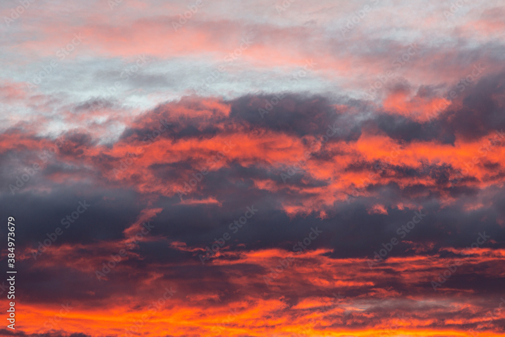 Dramatic colorful sky with afterglow and illuminated clouds Dramatic colorful sky with afterglow and illuminated clouds