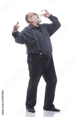 full- length . a successful older man drinks takeaway coffee