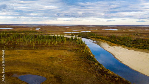 Landscape of the forest-tundra in autumn and the sandy river bank  bird s eye view.Arctic Circle  tunda. Beautiful landscape of  tundra from a helicopter.