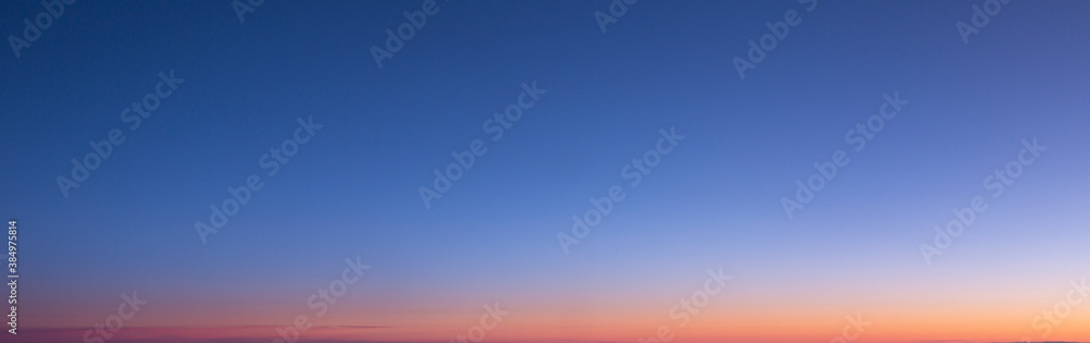 Fototapeta premium Dramatic colorful sky with afterglow and illuminated clouds