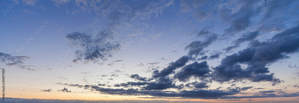 Dramatic colorful sky with afterglow and illuminated clouds