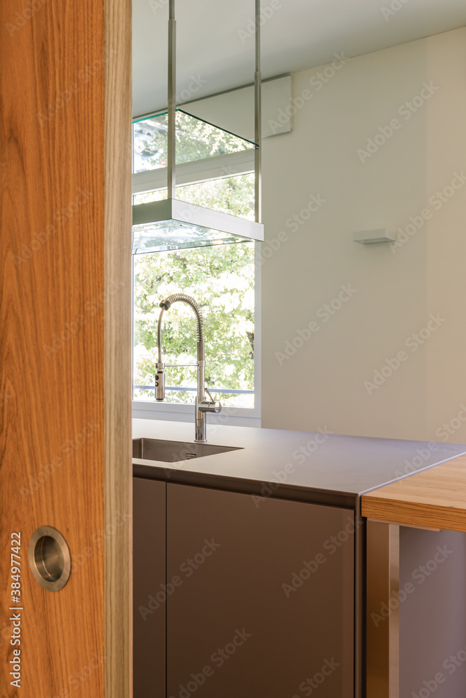 Fototapeta premium View of kitchen, detail of sink and worktop
