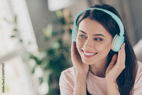 Close-up portrait of her she nice attractive pretty cute charming peaceful cheerful brown-haired girl wearing blue headset listening soul sound staying home apartment