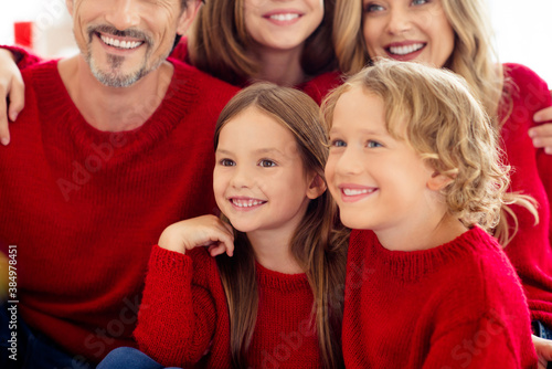 Close-up cropped view portrait of five people nice attractive cheerful cheery family embracing spending festal day vacation wearing knitwear in light white interior apartment indoor