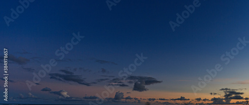 Dramatic colorful sky with afterglow and illuminated clouds