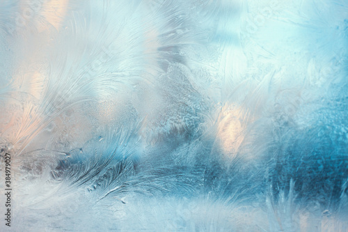 Colorful frosty pattern on the window