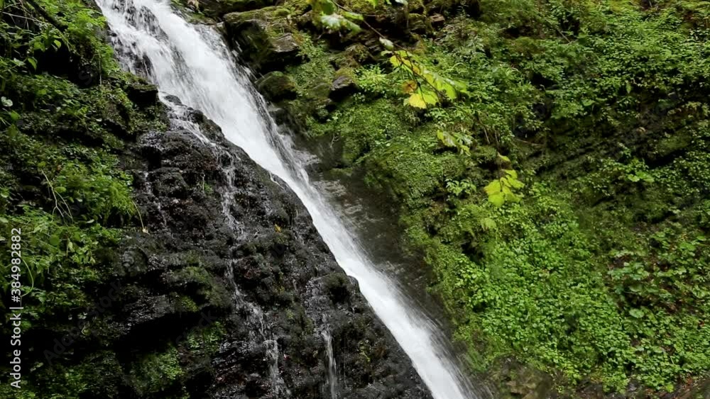 Wonderful waterfall on the mountain river Carpathians. Waterfall, fast mountain water, National Park of Skole Beskydy, Ukraine. Carpathian river, fast current, crystal water, pristine nature. Wonderful waterfall on the mountain river Carpathians. Waterfall, fast mountain water, National Park of Skole Beskydy, Ukraine. Carpathian river, fast current, crystal water, pristine nature.