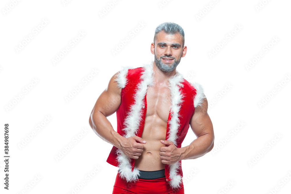 Sexy Santa Claus . Young muscular man wearing Santa Claus hat demonstrate his muscles. Isolated on white background.