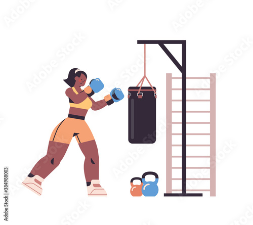 female boxer doing exercises with punching bag training healthy lifestyle boxing concept isolated full length vector illustration