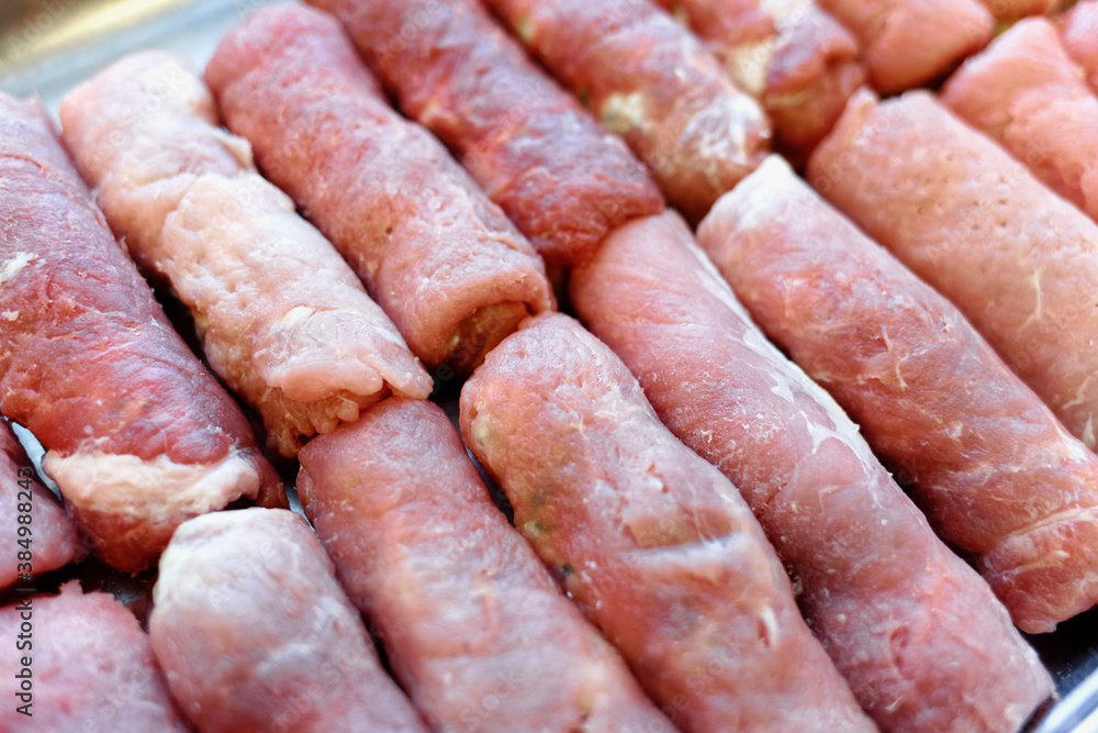 Cooking. Meatloaf rolls are stacked in a row Cooking. Meatloaf rolls are stacked in a row