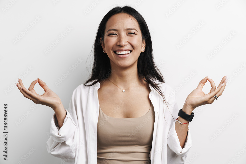 Beautiful laughing asian woman posing with fingers together Beautiful laughing asian woman posing with fingers together
