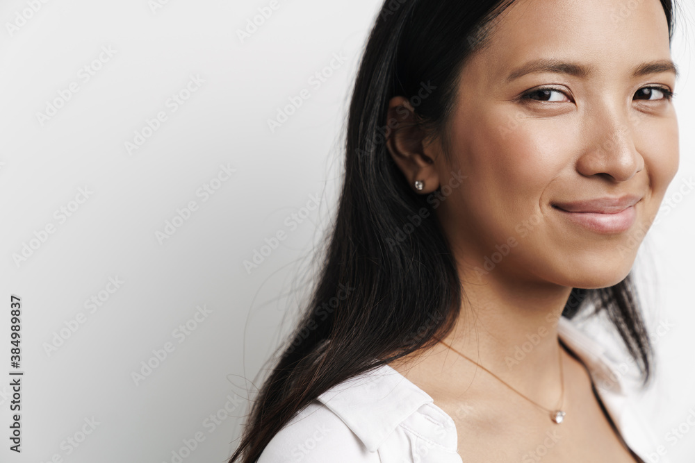 Beautiful happy asian woman smiling and looking at camera Beautiful happy asian woman smiling and looking at camera