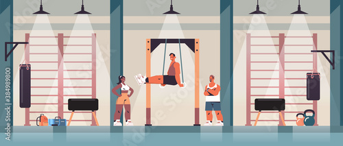 sportsman gymnast doing abs exercises man exercising on horizontal bar working out fitness training healthy lifestyle concept gym studio interior full length horizontal vector illustration