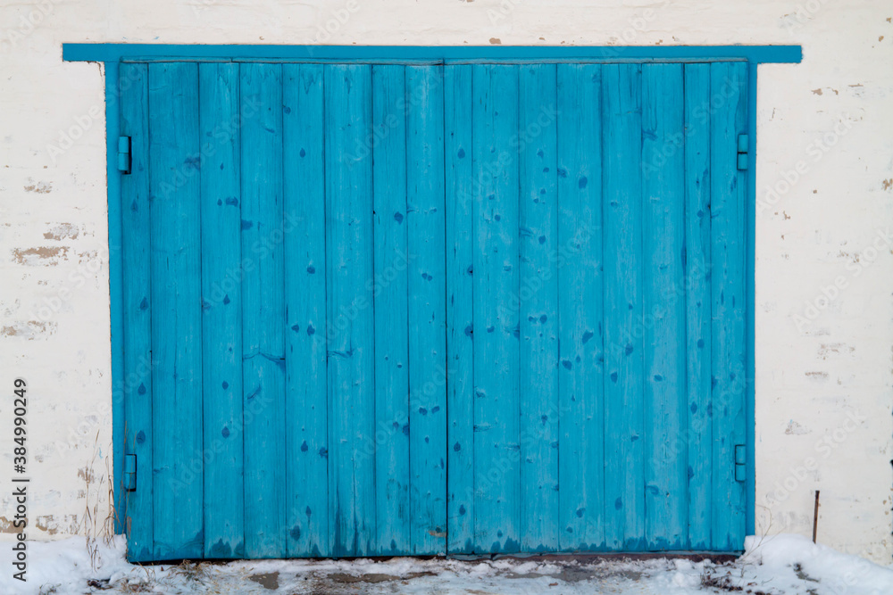 Blue gates made of wooden planks. Background. Copy space. Blue gates made of wooden planks. Background. Copy space.