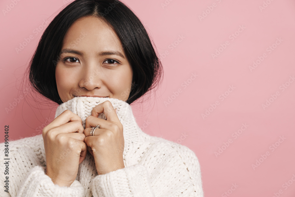 Beautiful happy asian woman posing and looking at camera Beautiful happy asian woman posing and looking at camera