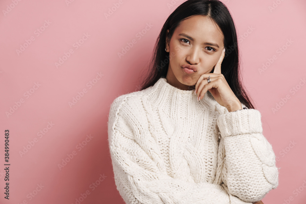 Beautiful charming asian woman grimacing and looking at camera Beautiful charming asian woman grimacing and looking at camera