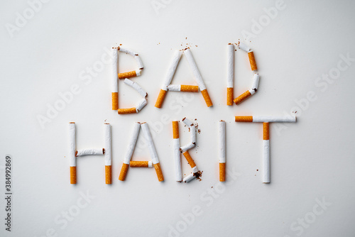 Inscription word BAD HABIT made out of cigarettes top view