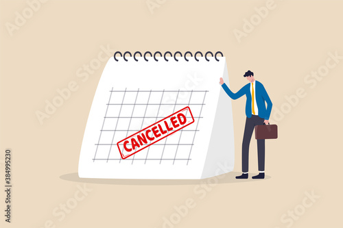 Business trip cancelled, marketing event, plan to launch new product postpone or cancelled due to COVID-19 Coronavirus pandemic concept, sad businessman standing with calendar with red Cancelled stamp