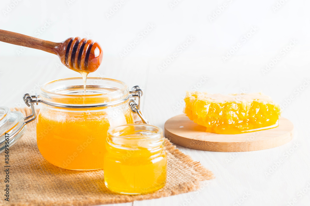 honey dipper and honeycomb. nuts and apples with honey and nuts of various kinds honey dipper and honeycomb. nuts and apples with honey and nuts of various kinds