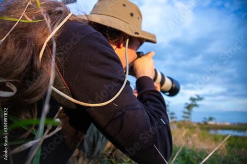 photographer taking pictures of wildlife with a telephoto lens © Fotoforce