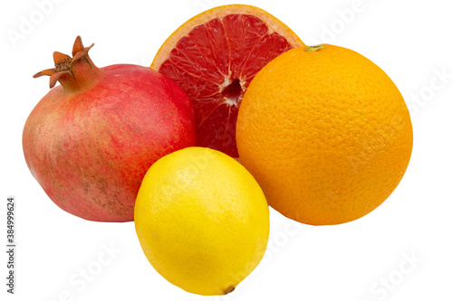 Grapefruit, pomegranate, orange and lemon on a white background
