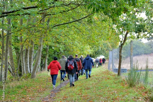 Fototapeta Naklejka Na Ścianę i Meble -  Senior hikers on the path at Plougrescant in Brittany France
