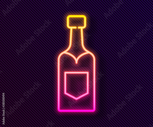 Glowing neon line Champagne bottle icon isolated on black background. Vector.