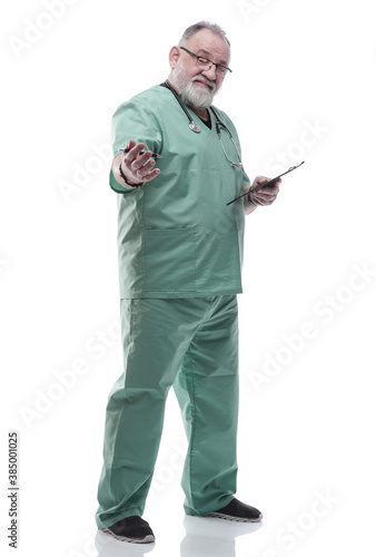 Mature doctor writing a prescription for a patient