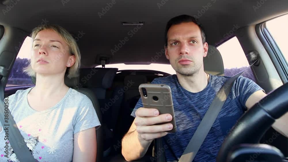 Man and woman driving during hard braking, car accident. Unsafe mobile phone use by people Man and woman driving during hard braking, car accident. Unsafe mobile phone use by people