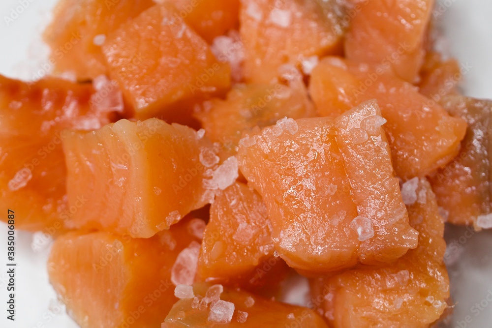 Pieces of salted trout fish with salt. Close up Pieces of salted trout fish with salt. Close up