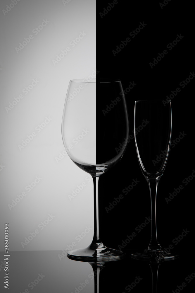
Two glass goblets on a gradient background