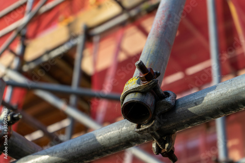 A close up of scaffolding poles on the front of a building