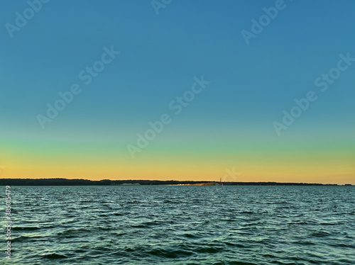 Vistula Spit canal works seen from Vistula Lagoon at sunset in summer.