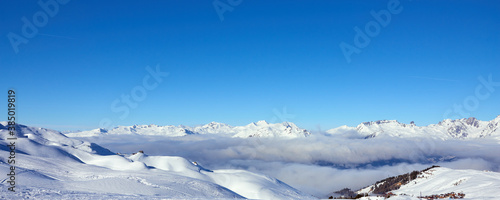 Panoramic view of the mountains near Tignes high-altitude ski resort in France during the winter season.