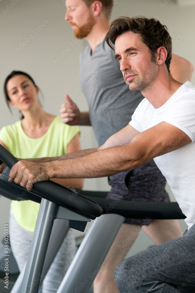 Group of friends exercising on treadmill machine Group of friends exercising on treadmill machine