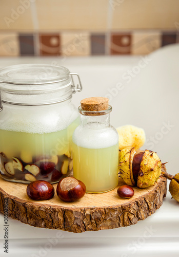Make natural liquid soap and shampoo concept. Soaking horse chestnut, Aesculus, buckeye in water, witch containing natural saponin the cleaning matter and has cleansing properties. Home bathroom.