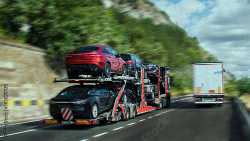 Photography Cars carrier at the road of Romania. Truck transporter