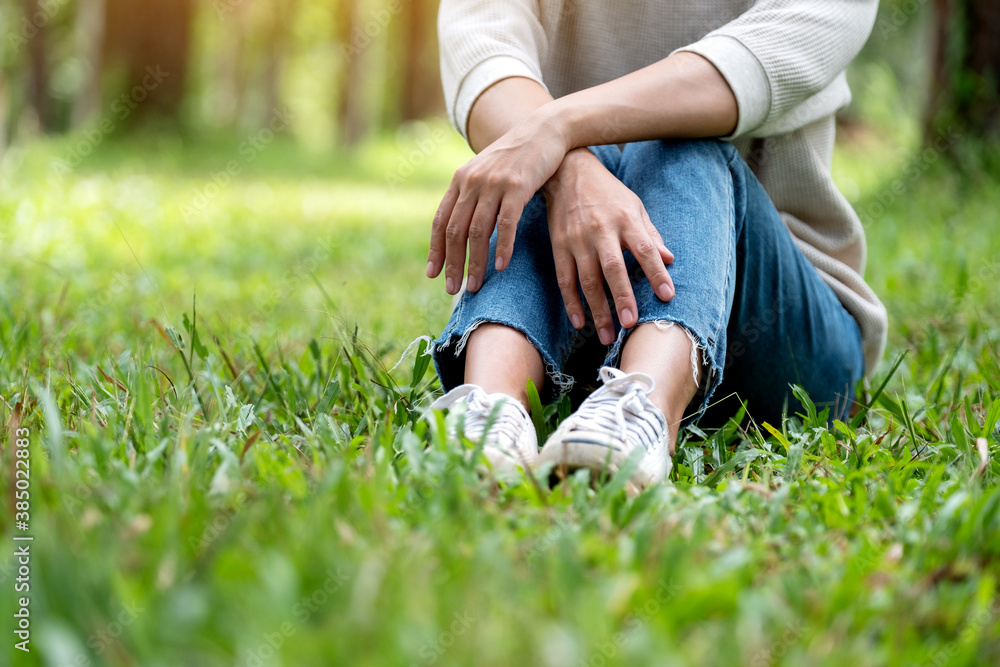 Closeup image of a woman sitting and relaxing in the park Closeup image of a woman sitting and relaxing in the park