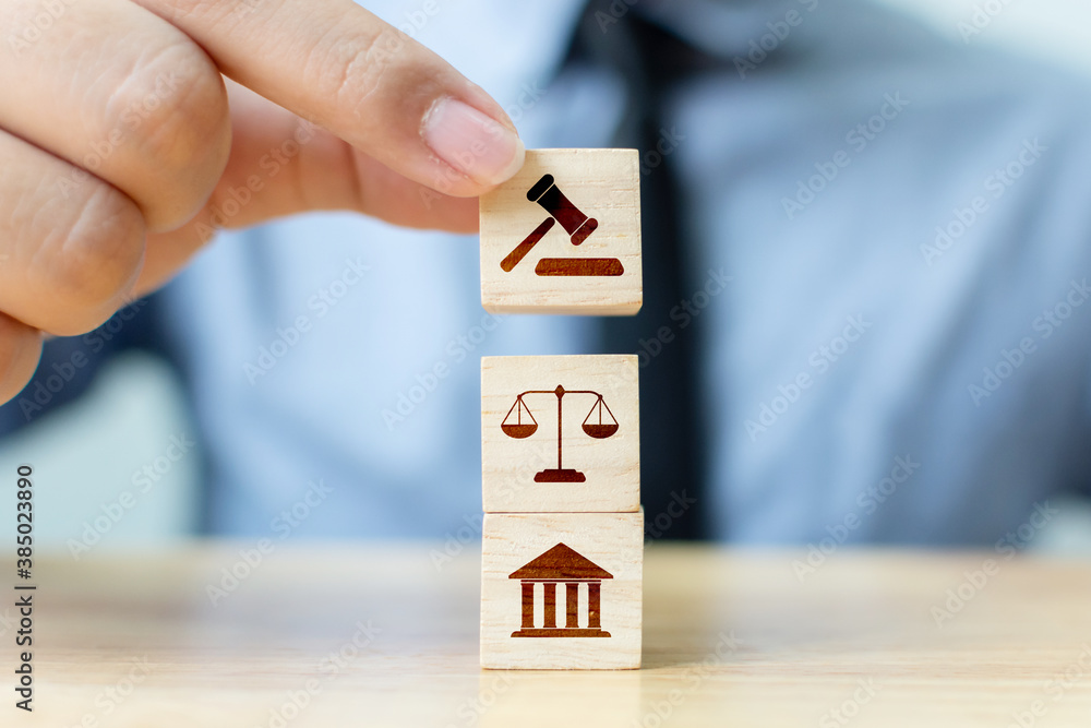 Naklejka premium Wooden block cube shape with icon law legal justice