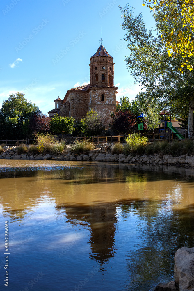 Exterior facade of the Church of San Sebastian S XVIII next to a pond