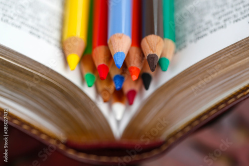 Colored pencils on a Bible, Catechism, France