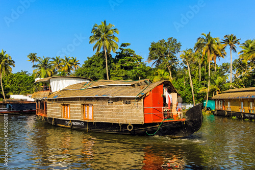 Kerala houseboat, an old rice, spice or goods barge converted for popular backwater cruises, Alappuzha (Alleppey), Kerala, India photo