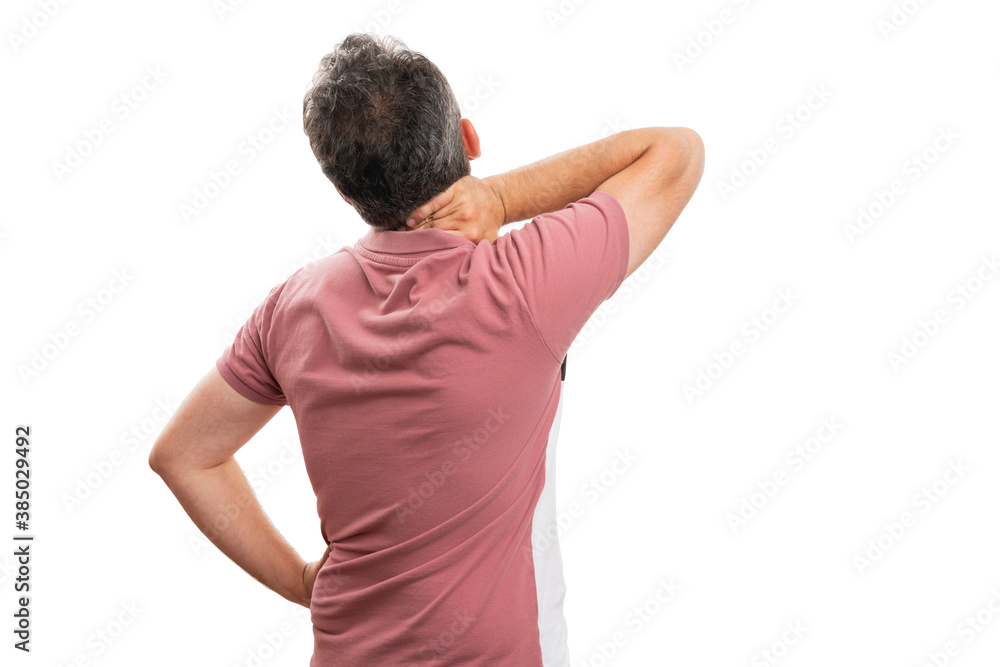 Male having muscle pain touching neck back to camera copyspace Male having muscle pain touching neck back to camera copyspace