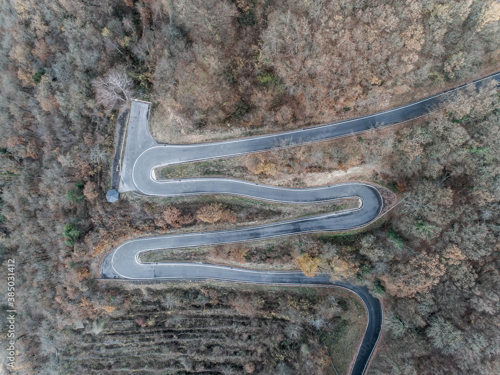 Seasons Concept winter or fall Aerial view Winding road serpentine mountain pass village Brodenbach Germany