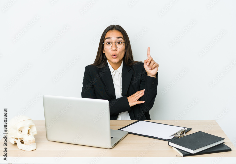 Young traumatologist asian woman isolated on white background having some great idea, concept of creativity. Young traumatologist asian woman isolated on white background having some great idea, concept of creativity.