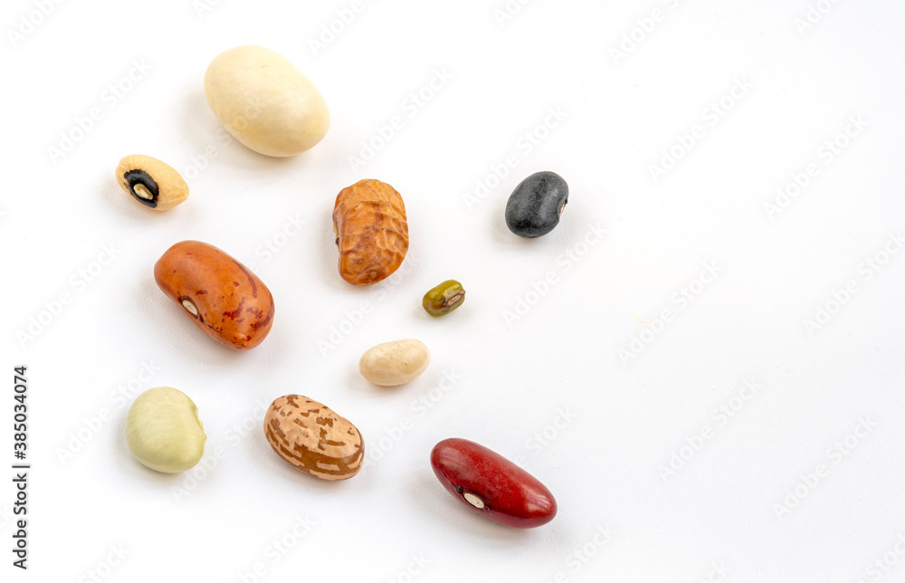 Macro varieties of healthy and organic beans on white background. Close up mix beans. Macro varieties of healthy and organic beans on white background. Close up mix beans.