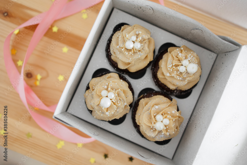 chocolate cupcakes with caramel cream in a box