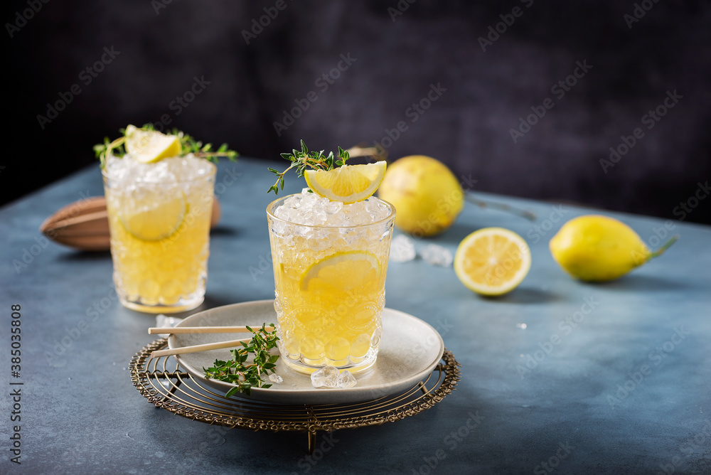 Cocktail with lemon, timo and crushed ice Cocktail with lemon, timo and crushed ice