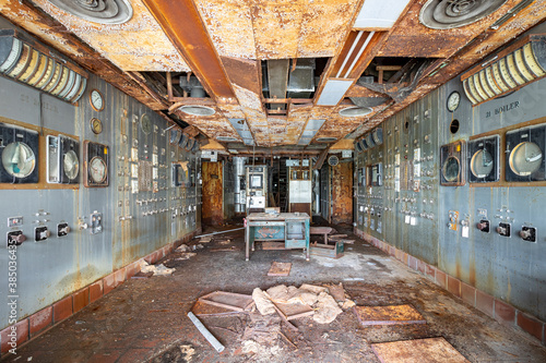 Photography Inside a control room in an abandoned shut down power plant—vandalism, decay, de